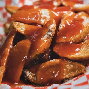 a close up of a basket of fries