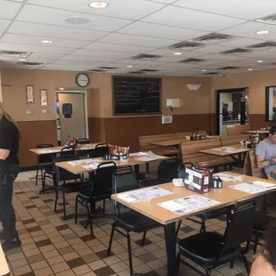 people sitting at tables in a restaurant