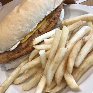 Friday fish sandwich with fries and coleslaw. HUGE portion. Big enough to share.