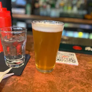 a glass of beer and a glass of water