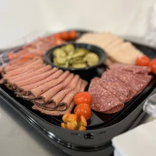 a platter of meat and vegetables