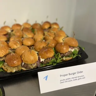 a tray of mini burgers