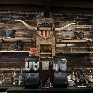  a bar with a bull&apos;s head on the wall