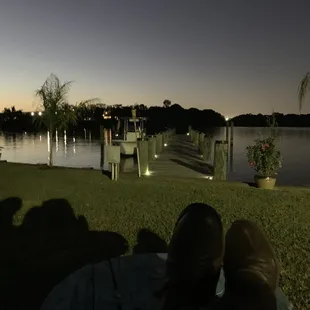 a man and his dog relaxing on the lawn