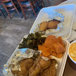 Dinner with chicken, yams, greens Macon cheese and cornbread