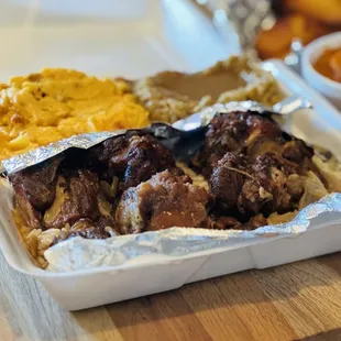 Ox.Tail Dinner w/Mac n Cheese and Cornbread Stuffing w/Gravy....Candied Yams and Cornbread (background)