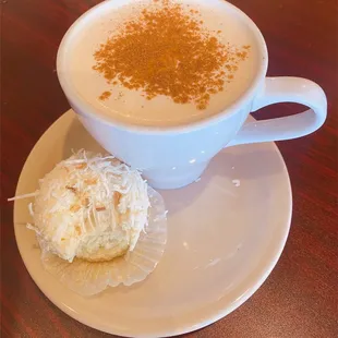 a cup of cappuccino and a muffin