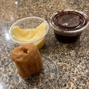 Churro bite with Bavarian cream and chocolate dips.
