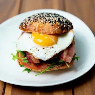 4oz angus breakfast burger, apple smoked wood bacon, cheddar cheese, chipotle aioli, arugula, tomato, on a homemade brioche bun