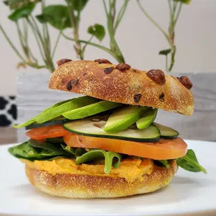 Veggie Sandwich, red Velvet pepper  roasted hummus, spinach, tomato, cucumber and avocado.