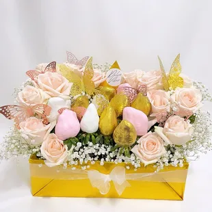 a flower arrangement in a yellow box
