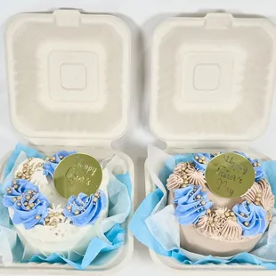 two cupcakes in a styrofoam container