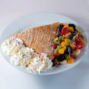 a slice of cake and fruit salad