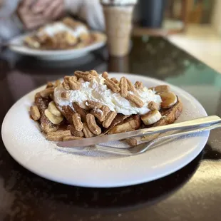 a plate of waffles and bananas