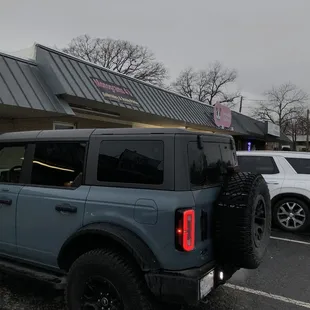 Exterior, its a quiet and bumpy shopping center.