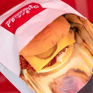 a cheeseburger wrapped in foil