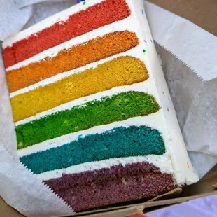 a slice of rainbow cake