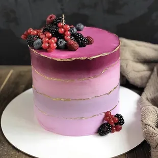 a cake with berries on top