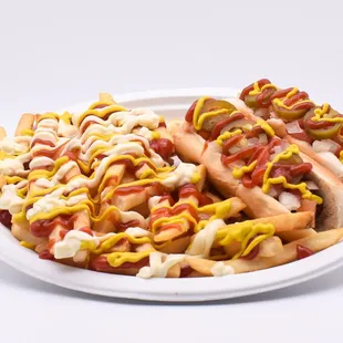 a plate of hotdogs with mustard and ketchup