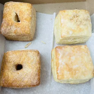 Two churro, one original glaze, one apple pie donuts