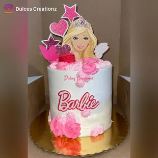 Barbie cake on whipped cream frosting and edible logo