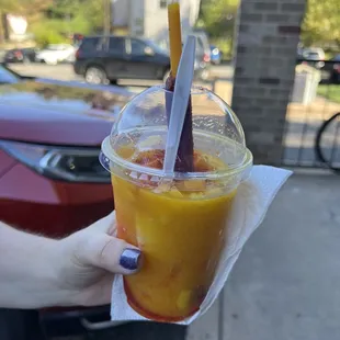 a person holding a drink