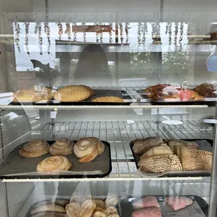 a display case filled with baked goods