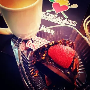 a chocolate dessert and a cup of coffee