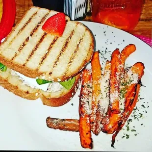 a grilled sandwich and sweet potato fries