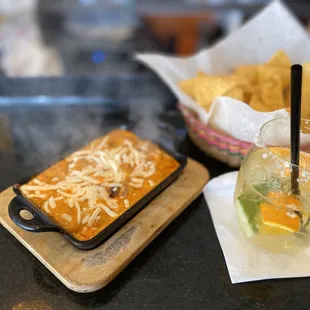 Chile Con Queso Dip, Fresh chips and salsa and half of a Margarita at the bar.