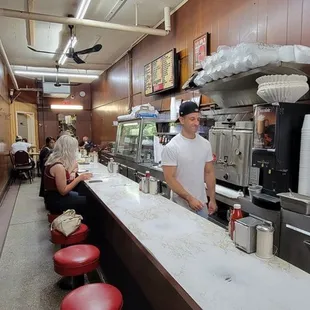 a man standing at the counter