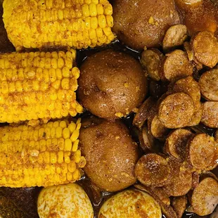 corn, potatoes, and sausage in a pot