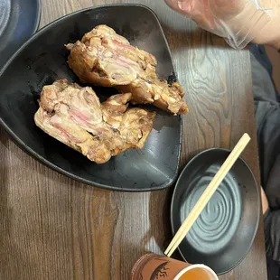 This is one pig feet and they sliced it in half for you. They also provide gloves so you can enjoy it without a big mess.