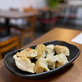 a plate of dumplings on a table