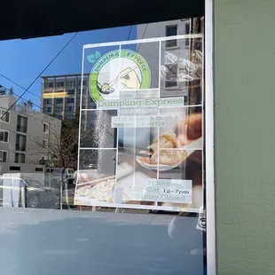 a sign in the window of a restaurant