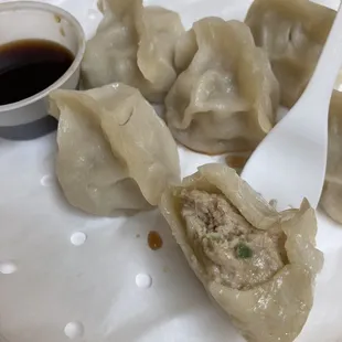 Chicken and cabbage dumplings (6) for $10. Photo shows the inside and the dumpling skin to filling ratio