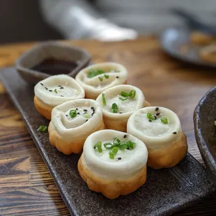 Pan fried juicy pork bao - 6 for $13.95. Best item on the menu.