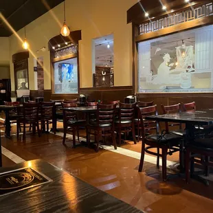 empty tables and chairs in a restaurant