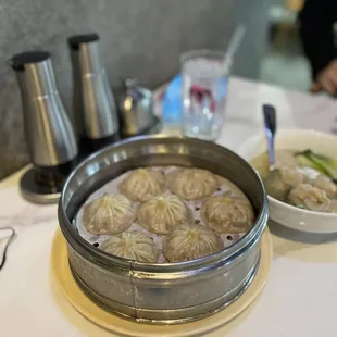 a bowl of dumplings and a bowl of soup