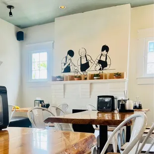 a dining room with a television and a fireplace