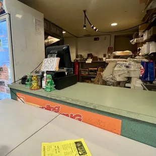 a sign on the counter of a grocery store