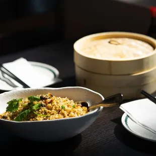 a bowl of rice and chopsticks