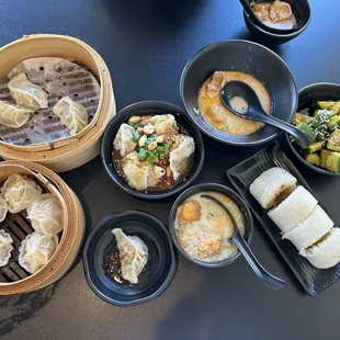 Shanghai dumplings, pork and cabbage dumplings, wonton in chili oil, savory soy milk, cucumber salad, sticky rice roll