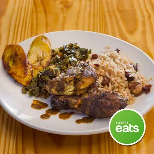Notorious Jerk Chicken Platter Served With Rice and Pea, Callaloo, and a side of Sweet Plantain