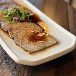 牛舌 Beef Tongue w/ thousand year old sauce | $12.95