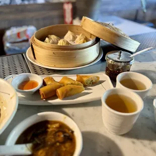 Hot and sour soup, jasmine tea, spring rolls, XLB