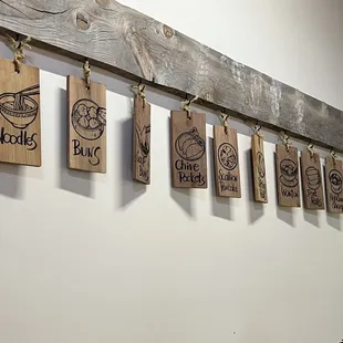 a row of tea bags hanging on a wall