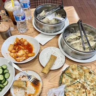 Pork Steamed Dumpling, Vegetable Steamed Dumpling, Soup bun, Kimchi salad, Vegetable Spring Roll, Cucumber salad, Scallion Pancake