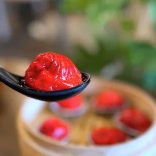 Tom Yum XLB w/ pork belly, coconut milk, wrapped in beet skin | $10.50