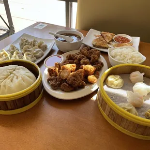 Dim sum combo, crispy chicken, pan fried dumplings, scallion pancakes, hot and sour soup, big bun.